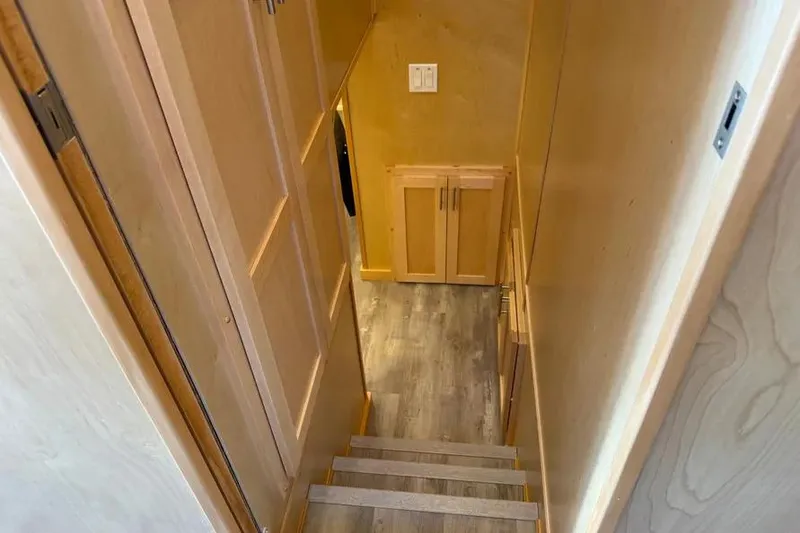 Slide: The Image of Interior staircase of 2026 Sumerset Voyager with wooden finish and modern design. - 16