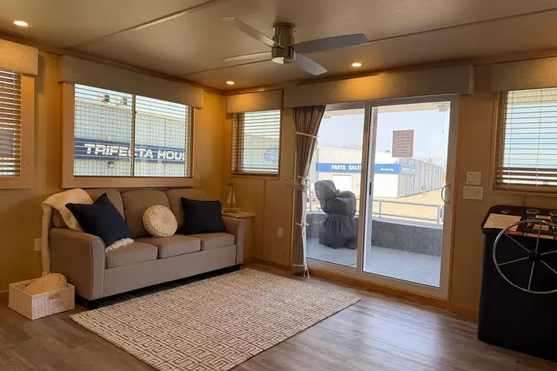 Slide: The Image of Modern interior of 2026 Sumerset Voyager houseboat with cozy seating and large windows. - 4