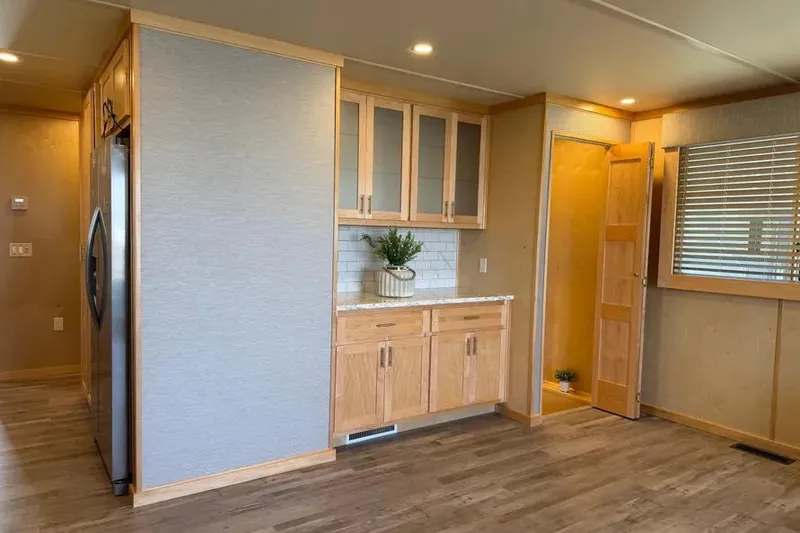 Slide: The Image of Modern kitchen interior in 2026 Sumerset Voyager, featuring wooden cabinets and stainless steel appliances. - 8