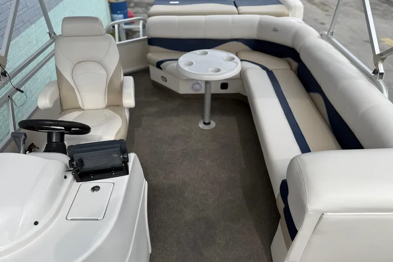Slide: The Image of Interior of 2007 SunCatcher LX 22 SE pontoon boat with seating and steering console. - 9