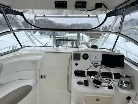Slide: The Image of Interior view of a 2006 Boston Whaler 305 Conquest boat cockpit. - 12