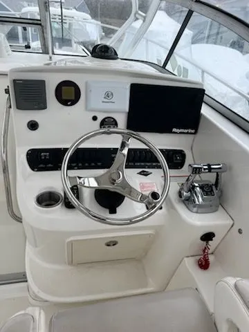 Slide: The Image of Helm of a 2006 Boston Whaler 305 Conquest boat. - 13