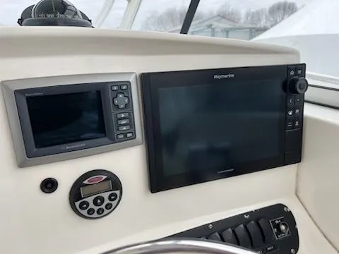Slide: The Image of Dashboard of a 2006 Boston Whaler 305 Conquest with navigation systems. - 14