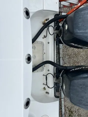 Slide: The Image of Boston Whaler 305 Conquest 2006 with dual outboard engines. - 18