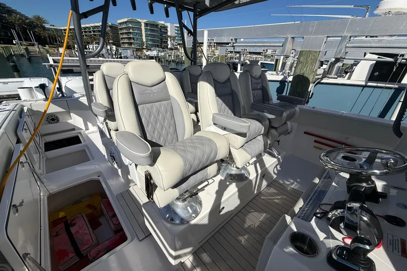 Slide: The Image of Luxurious seating on 2022 Invincible 40 Catamaran, docked at marina. - 11