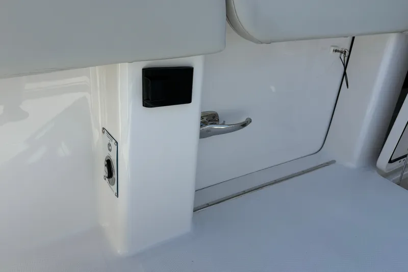Slide: The Image of Invincible 40 Catamaran 2022 interior detail with sleek white finish and metal handle. - 13