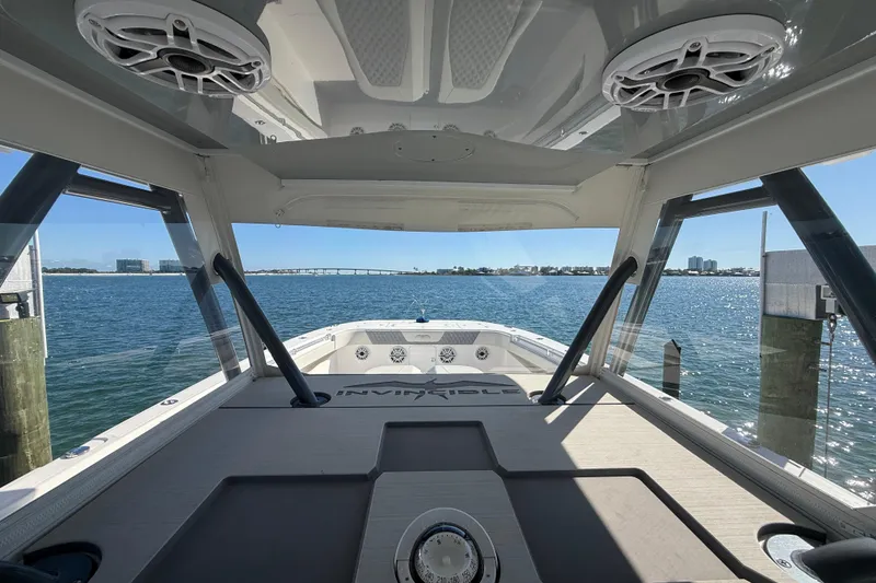 Slide: The Image of Invincible 40 Catamaran 2022 interior view with ocean backdrop and modern design. - 15