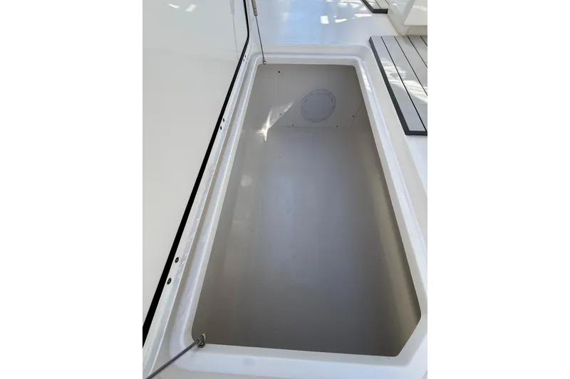 Slide: The Image of Storage compartment on 2022 Invincible 40 Catamaran, showcasing spacious interior design. - 19
