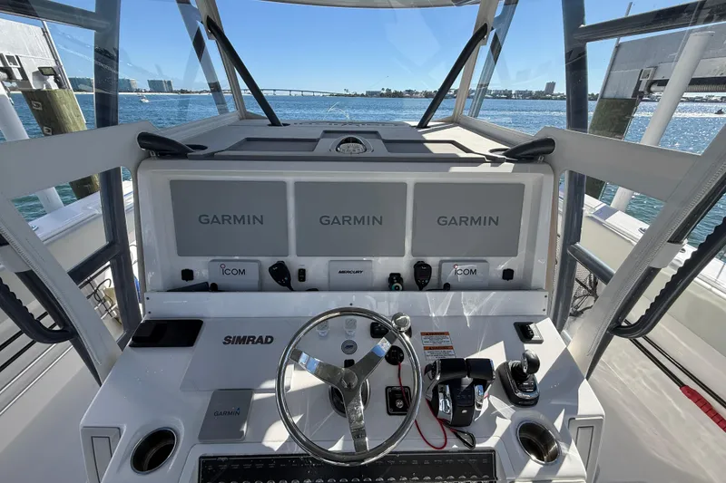 Slide: The Image of Invincible 40 Catamaran 2022 helm with Garmin displays and Simrad controls. - 8