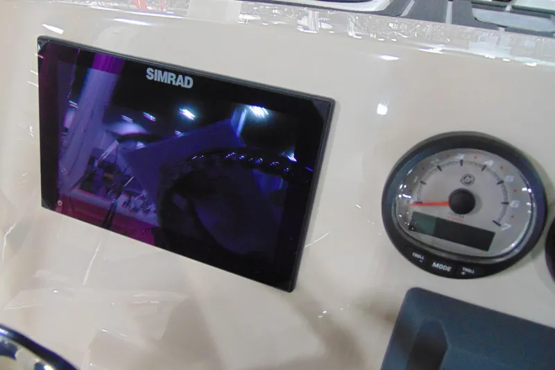Slide: The Image of Dashboard of 2026 Boston Whaler 220 Dauntless with Simrad display and gauge. - 18