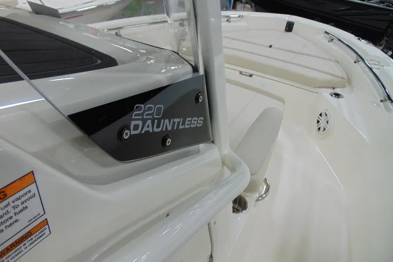 Slide: The Image of 2026 Boston Whaler 220 Dauntless boat interior with model nameplate. - 19
