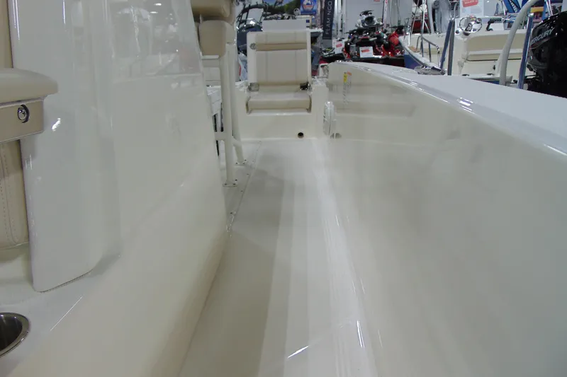 Slide: The Image of Interior view of 2026 Boston Whaler 220 Dauntless boat, showcasing sleek design and seating. - 22