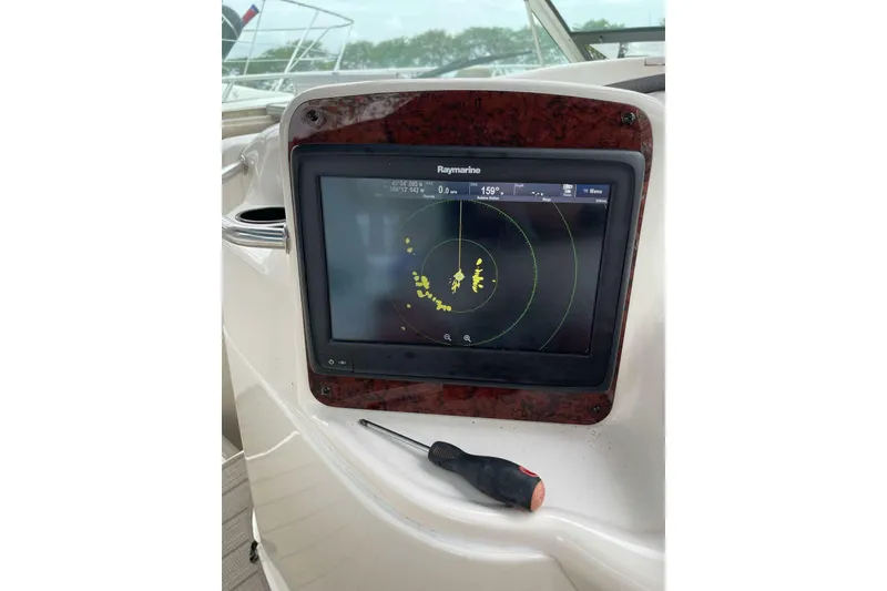 Slide: The Image of Raymarine radar display on 1997 Sea Ray Sundancer 400 yacht dashboard. - 17