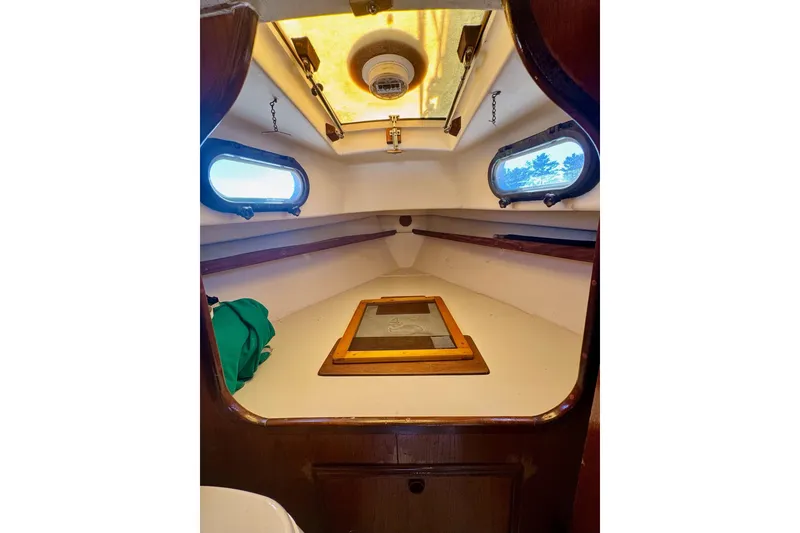 Slide: The Image of Porthole window inside a 1981 Cape Dory 25 sailboat cabin. - 11