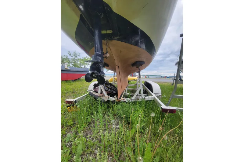 Slide: The Image of 1981 Cape Dory 25 sailboat interior with clothes drying, docked at marina. - 17