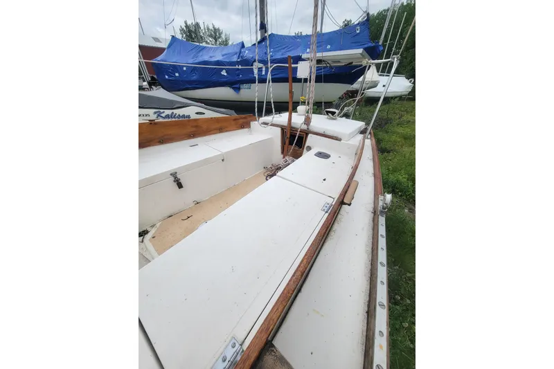Slide: The Image of 1981 Cape Dory 25 sailboat on trailer in garage, front view. - 21