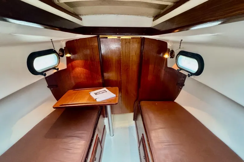 Slide: The Image of Tablet on wooden table inside 1981 Cape Dory 25 sailboat cabin. - 8