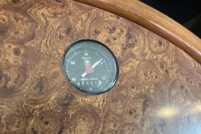 Slide: The Image of Wooden dashboard with engine hours gauge, Horizon 56, 2001 model. - 26