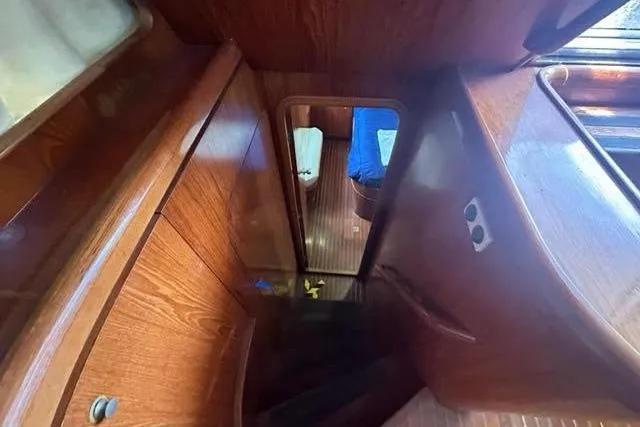 Slide: The Image of Interior view of a 2001 Horizon 56 yacht with wooden finishes and cabin access. - 36