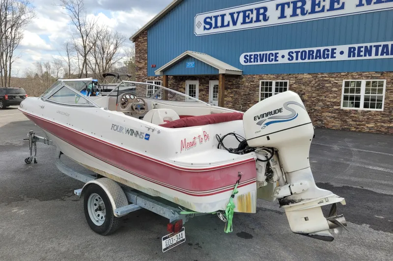 Slide: The Image of 1997 Four Winns 180 Horizon boat with Evinrude motor at Silver Tree Marine. - 5