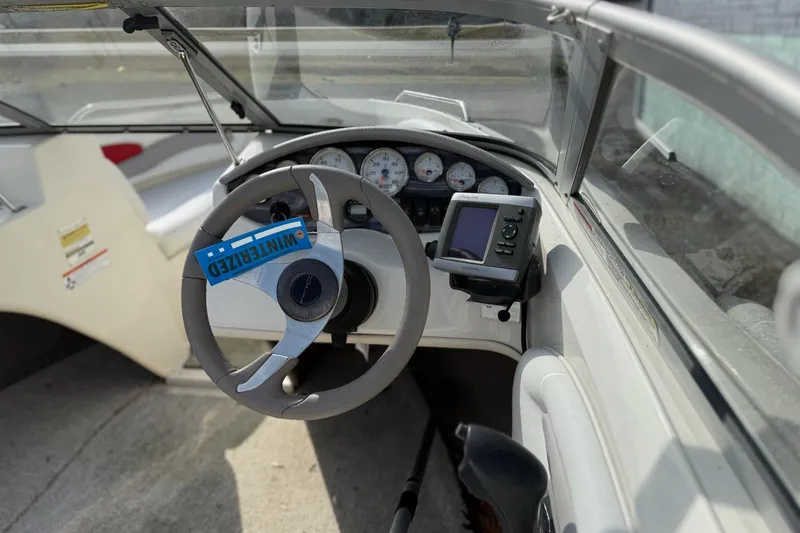 Slide: The Image of 2008 Stingray 205 LS/LX/LR boat dashboard with steering wheel and gauges. - 7