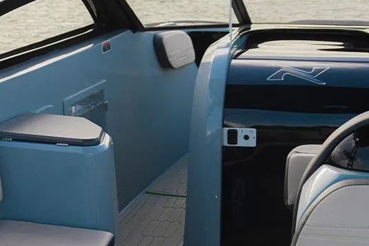 Slide: The Image of Interior of 2026 NX Boats NX260, featuring sleek design and modern seating. - 10