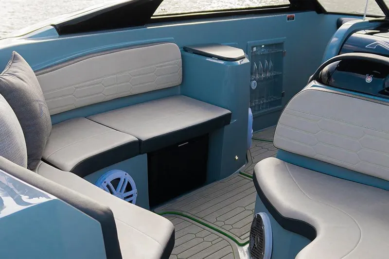 Slide: The Image of Interior of 2026 NX Boats NX260, featuring modern seating and sleek design elements. - 9