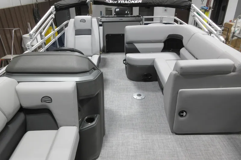 Slide: The Image of 2026 Sun Tracker SportFish 20 DLX pontoon boat interior with gray seating and modern design. - 3