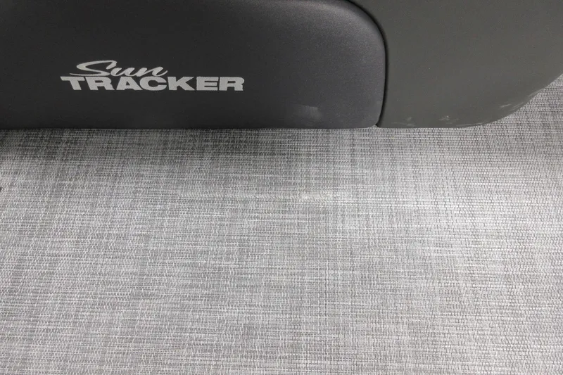 Slide: The Image of 2026 Sun Tracker SportFish 20 DLX logo on textured surface. - 6