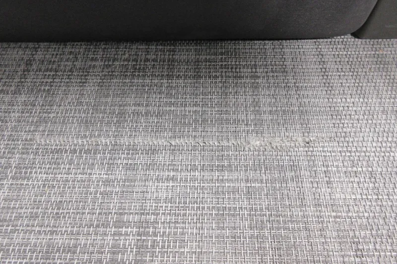 Slide: The Image of Woven flooring detail of 2026 Sun Tracker SportFish 20 DLX boat. - 7