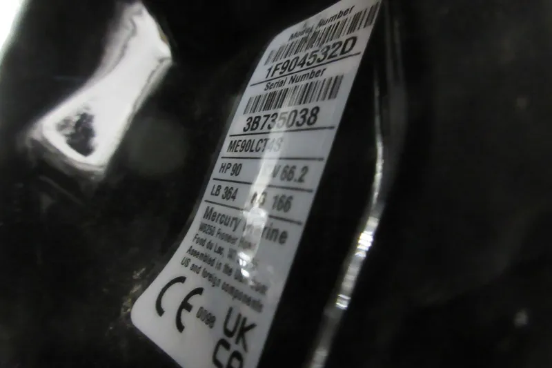 Slide: The Image of Label on a 2026 Sun Tracker SportFish 20 DLX boat engine, showing specifications and serial number. - 8