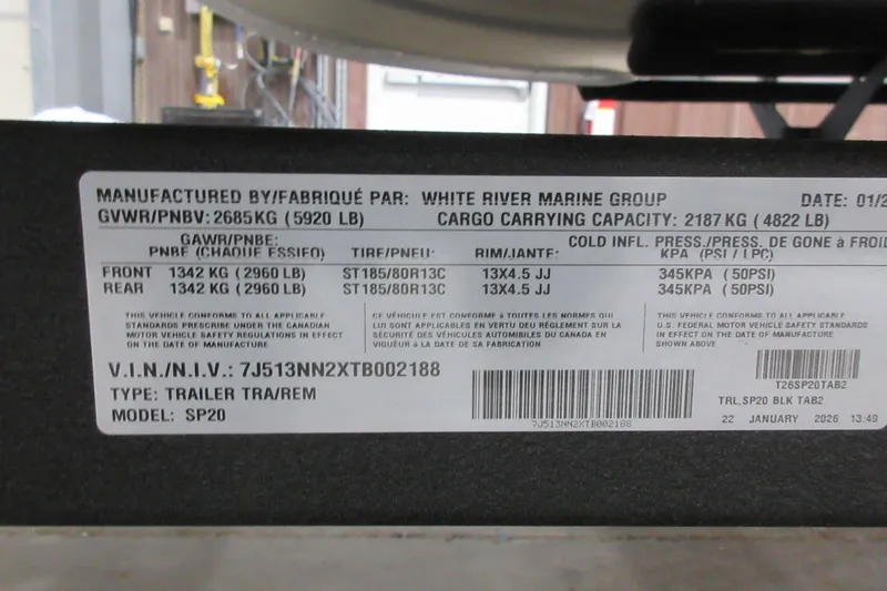 Slide: The Image of Label on Sun Tracker SportFish 20 DLX trailer, showing specifications and compliance details. - 9