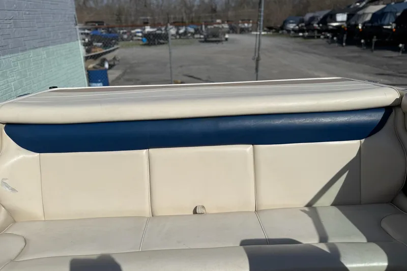 Slide: The Image of 1998 Bryant 214 Limited boat interior with white and blue upholstery. - 11