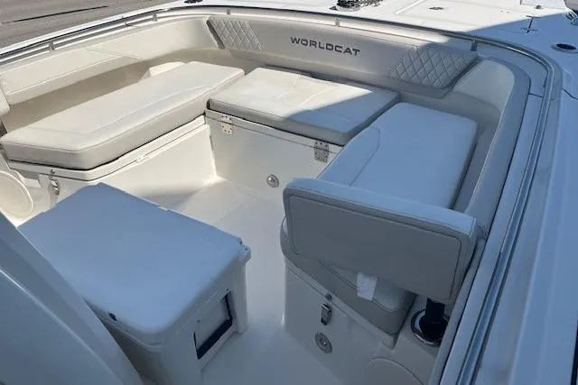 Slide: The Image of 2024 World Cat 260 CC-X boat interior with cushioned seating and storage compartments. - 5