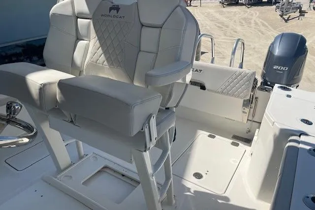 Slide: The Image of 2024 World Cat 260 CC-X boat interior with white seating and dual engines. - 7