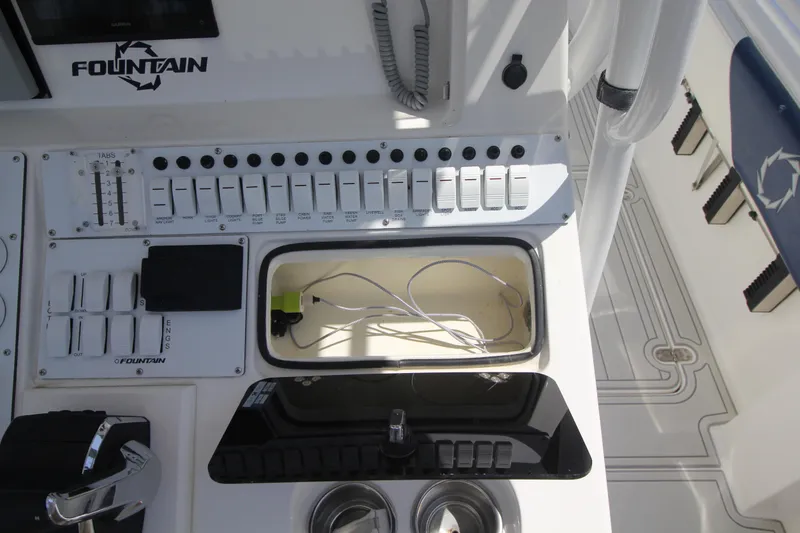 Slide: The Image of Control panel of a 2007 Fountain 34 Sportfish CC boat with throttle and gauges. - 10
