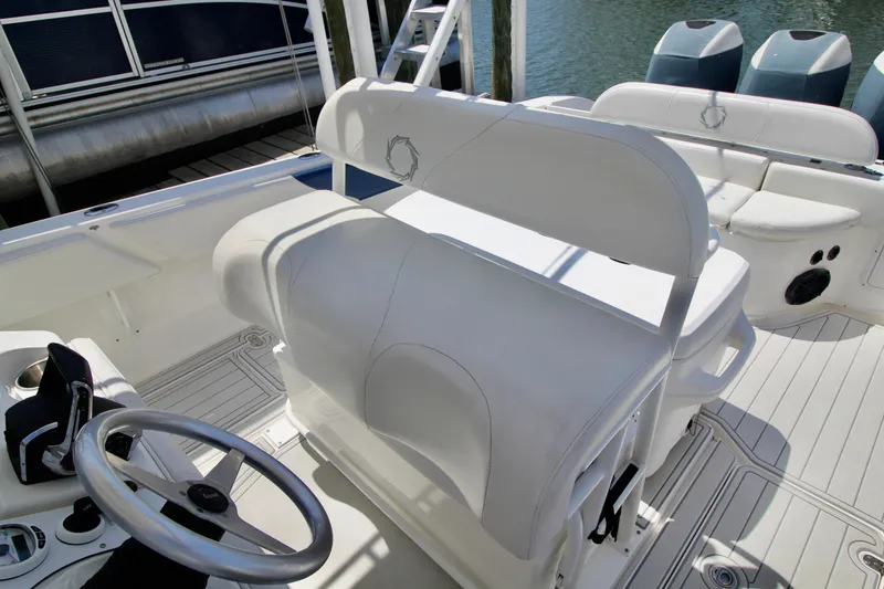 Slide: The Image of Control panel of 2007 Fountain 34 Sportfish CC boat with switches and storage compartment. - 11