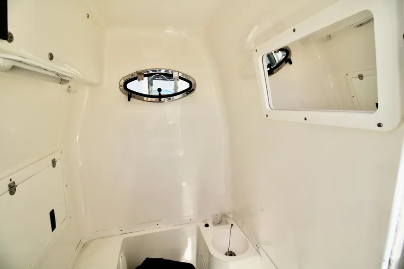 Slide: The Image of Control panel of a 2007 Fountain 34 Sportfish CC boat with branded flooring. - 14