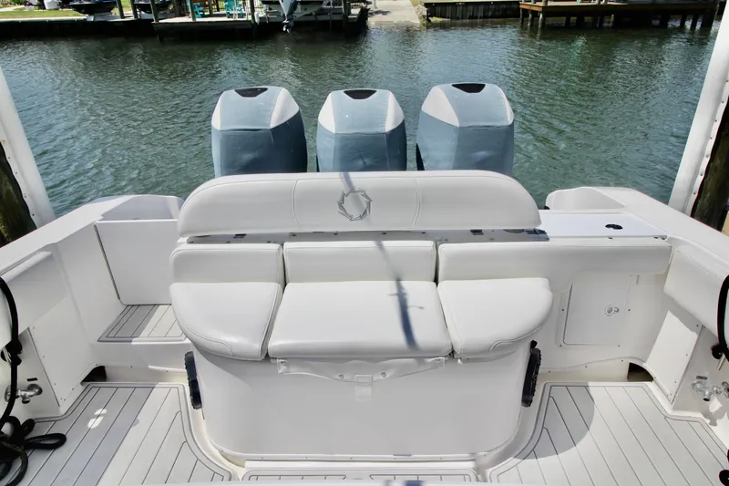 Slide: The Image of 2007 Fountain 34 Sportfish CC boat interior with compact marine toilet and sink. - 15