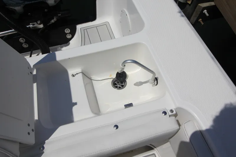Slide: The Image of 2007 Fountain 34 Sportfish CC boat with triple outboard engines and spacious seating. - 17