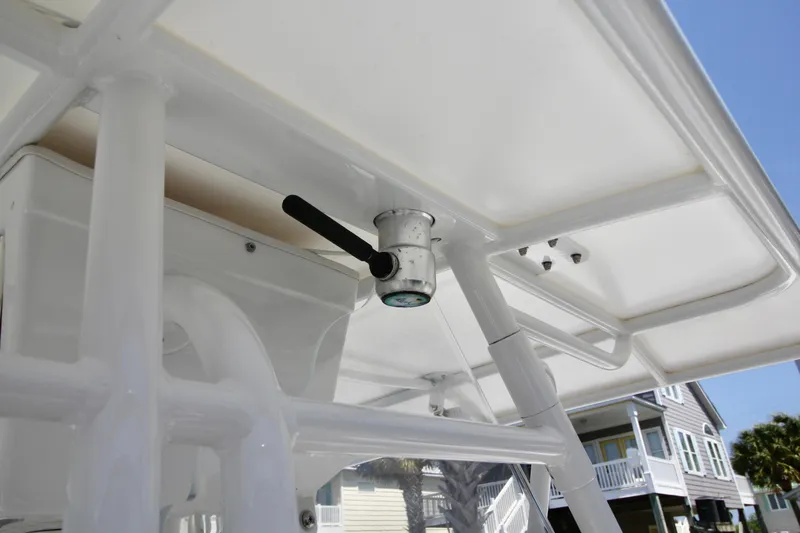 Slide: The Image of 2007 Fountain 34 Sportfish CC boat deck with rod holders and Garmin navigation system. - 18