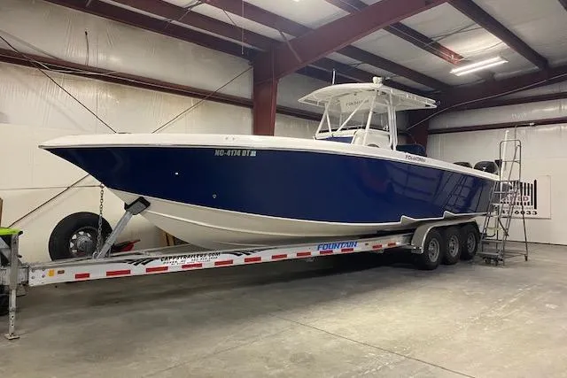 Slide: The Image of 2007 Fountain 34 Sportfish CC boat on trailer in indoor storage facility. - 2