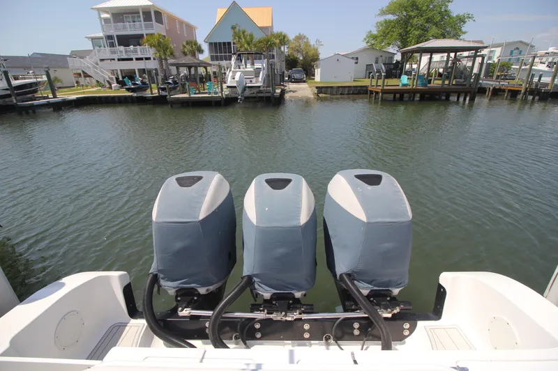 Slide: The Image of 2007 Fountain 34 Sportfish CC boat deck with storage compartment open. - 30