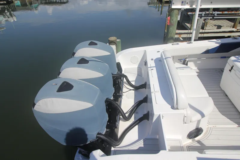 Slide: The Image of 2007 Fountain 34 Sportfish CC boat deck with storage compartment open. - 31
