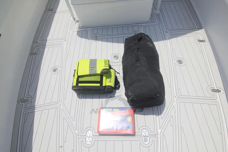 Slide: The Image of Three Mercury outboard engines on grass with a white truck in the background. - 35