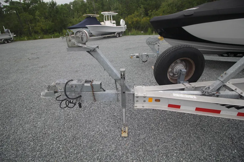 Slide: The Image of Trailer hitch and boat trailer for 2007 Fountain 34 Sportfish CC on gravel lot. - 40