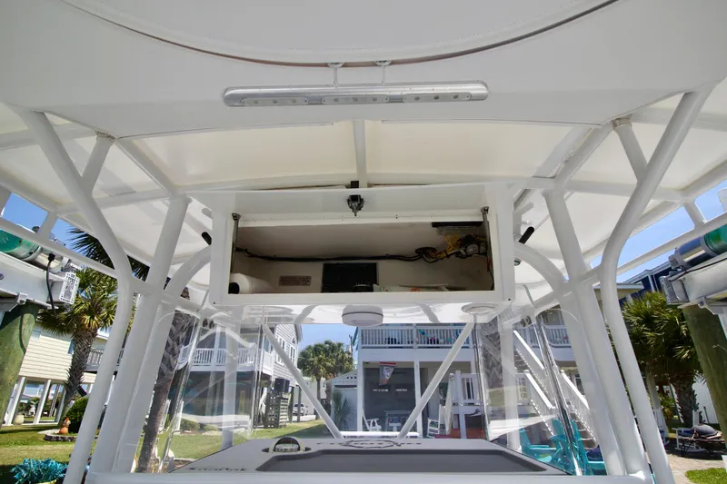 Slide: The Image of Dashboard of a 2007 Fountain 34 Sportfish CC boat with various gauges and controls. - 9