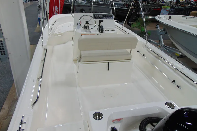 Slide: The Image of 2026 Boston Whaler 190 Montauk boat interior with steering console and seating. - 4