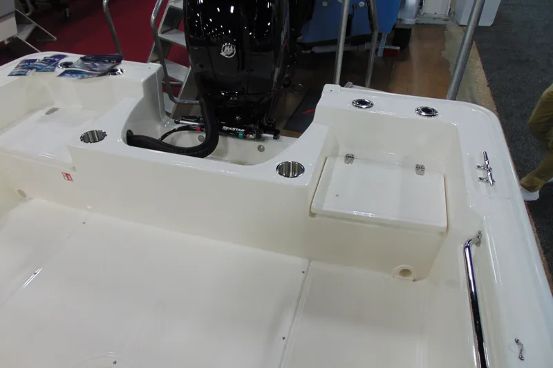 Slide: The Image of 2026 Boston Whaler 190 Montauk boat interior with motor and seating area. - 9