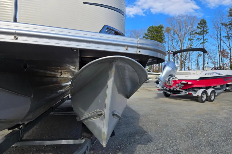 Slide: The Image of 2020 Avalon LSZ VRB 24' pontoon boat with trailer in outdoor setting. - 10